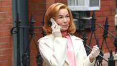 renee zellweger headshot holding a phone