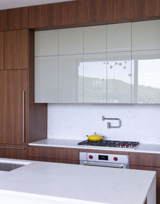 A contemporary minimalist kitchen with wooden cabinets