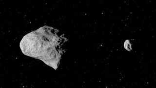A photo of a large asteroid next to a small asteroid