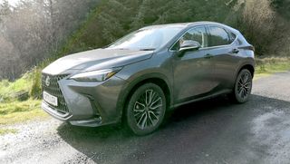 lexus nx 450+ hybrid parked on a country road