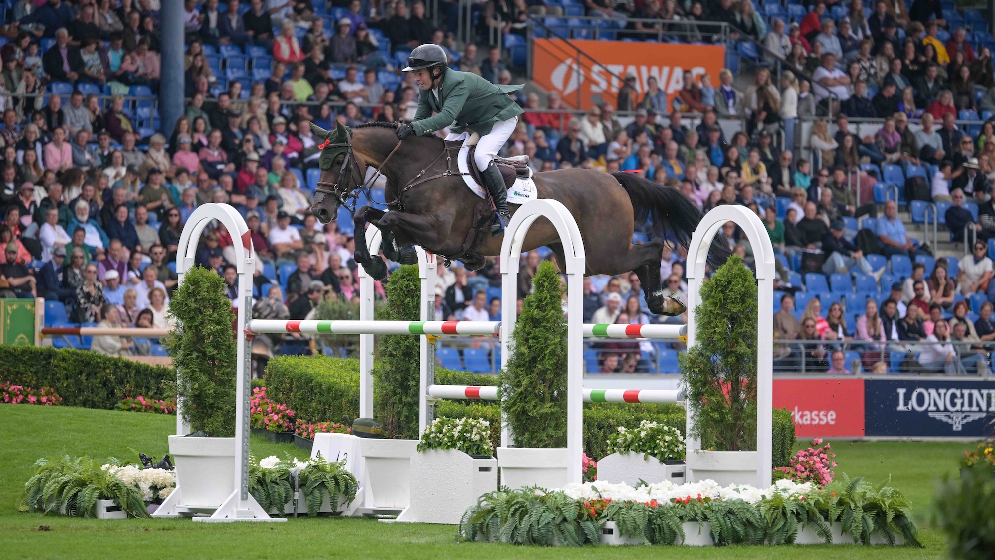 Cian O'Connor and Chatolinue PS of Ireland clear an oxer at the World Championships