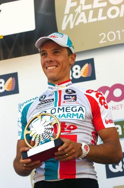 Philippe Gilbert (Omega Pharma-Lotto) holds the winner's trophy.