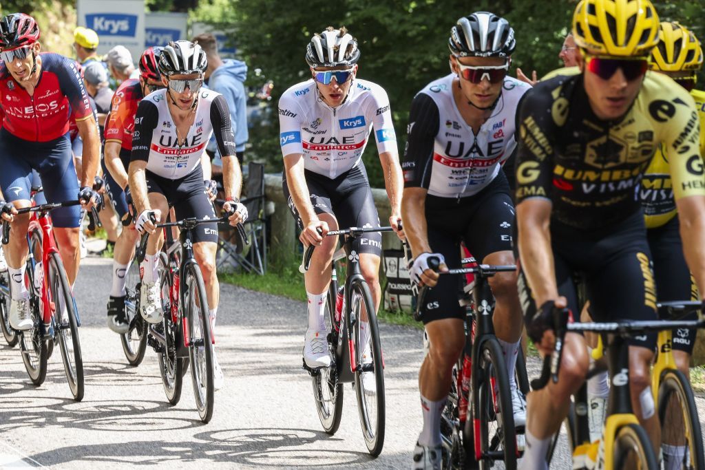 Tadej Pogacar rides in the peloton with his UAE Team Emirates teammates