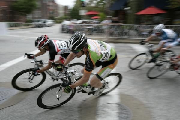 The men's field flies through turn one
