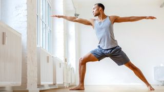 Man practicing yoga at a studio