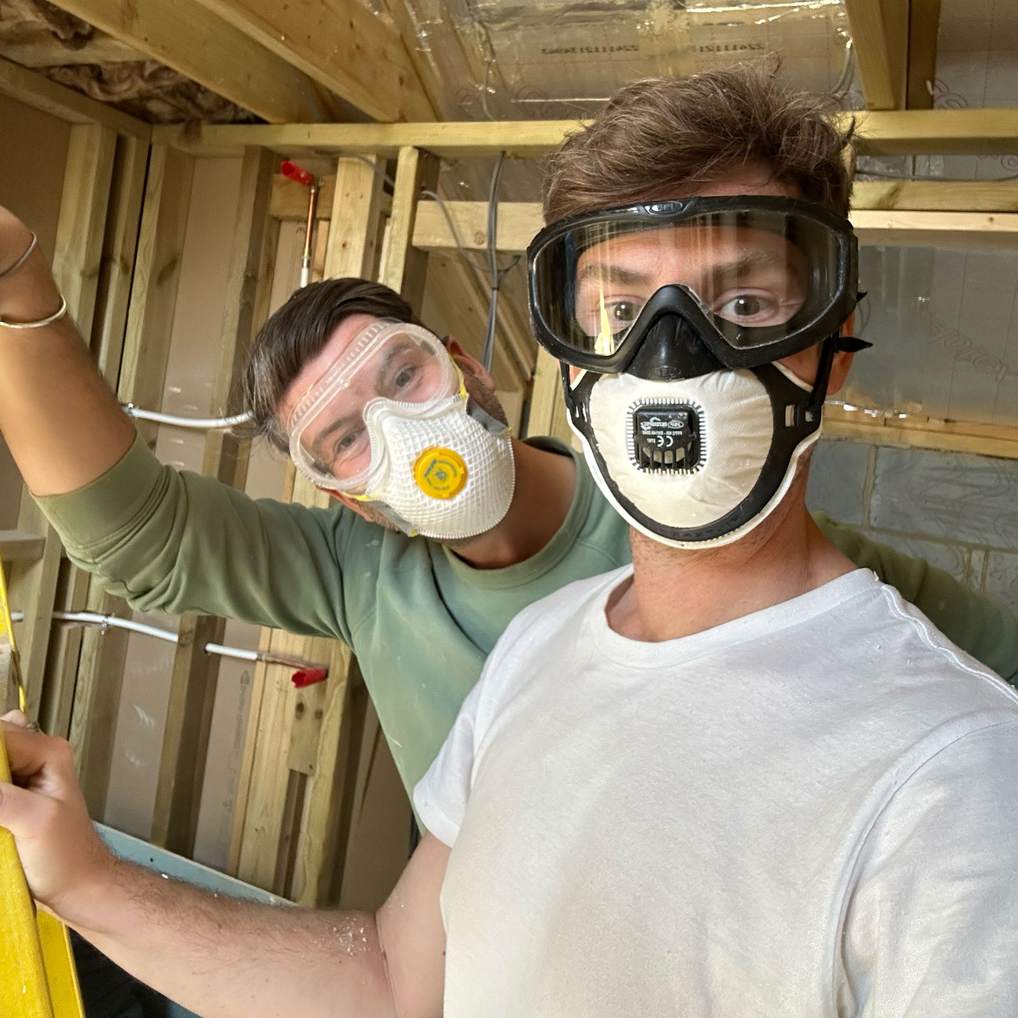 Two men in face masks and googles for DIY