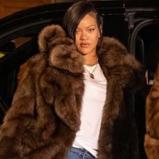 Rihanna and A$AP Rocky posed after dinner in matching fur coats and baggy jeans