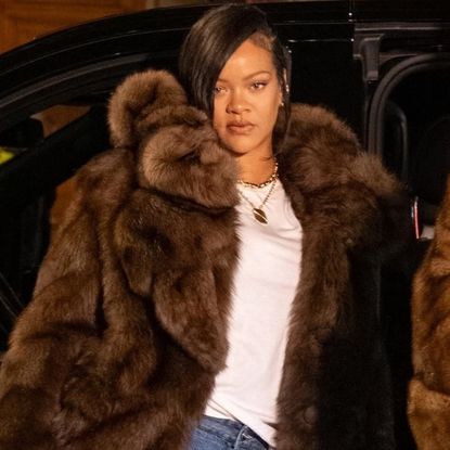 Rihanna and A$AP Rocky posed after dinner in matching fur coats and baggy jeans