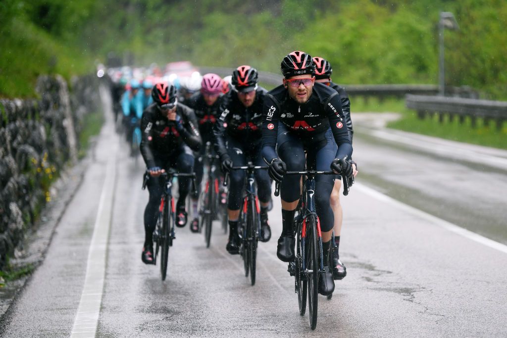 CORTINA DAMPEZZO ITALY MAY 24 Filippo Ganna of Italy and Team INEOS Grenadiers leads The Peloton during the 104th Giro dItalia 2021 Stage 16 a 153km stage shortened due to bad weather conditions from Sacile to Cortina dAmpezzo 1210m Rain girodiitalia Giro on May 24 2021 in Cortina dAmpezzo Italy Photo by Tim de WaeleGetty Images