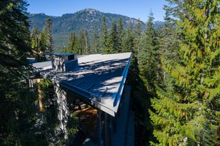 Trail's Edge House by Openspace Architecture amid forested mountains in Whistler