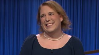 Jeopardy! champion Amy Schneider is shown wearing her pearl necklace.