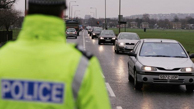 Policeman surveying motorists in London