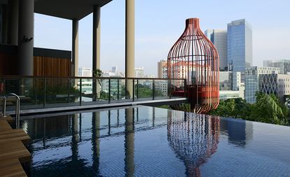ParkRoyal exterior view of pool and city