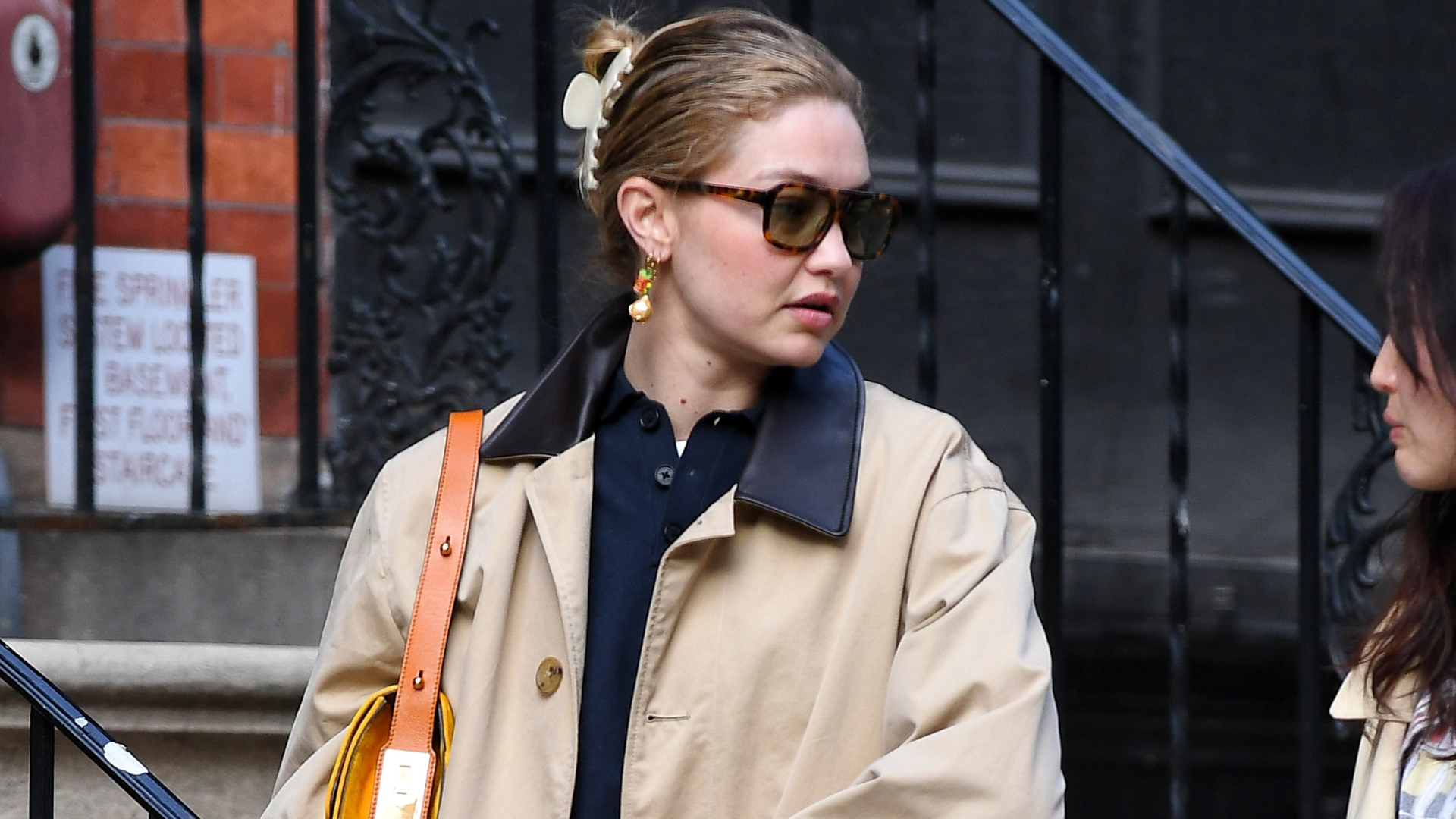 Gigi Hadid wore a New York City It-girl's uniform: a navy polo, barn jacket, jeans and the soft leather loafers trend