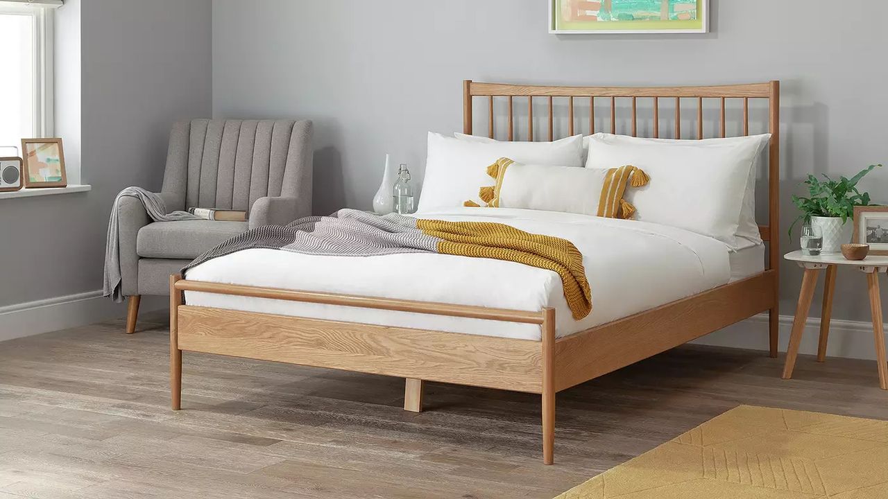 A wooden spindle back bed in a bedroom