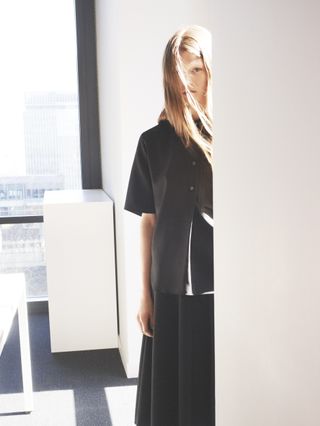 Model wearing shirt and skirt from Lucas Ossendrijver collection