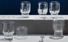 Five crystal vessels featuring heavy cups and thin lids