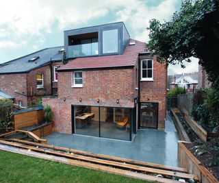 metal clad dormer loft conversion with balcony and large glazed picture window