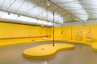 yellow room with hanging shapes