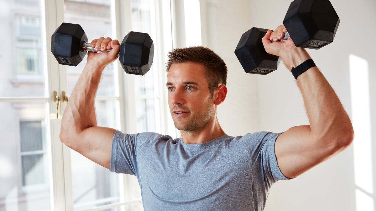 Man doing dumbbell squat clean and press exercise Vector Image