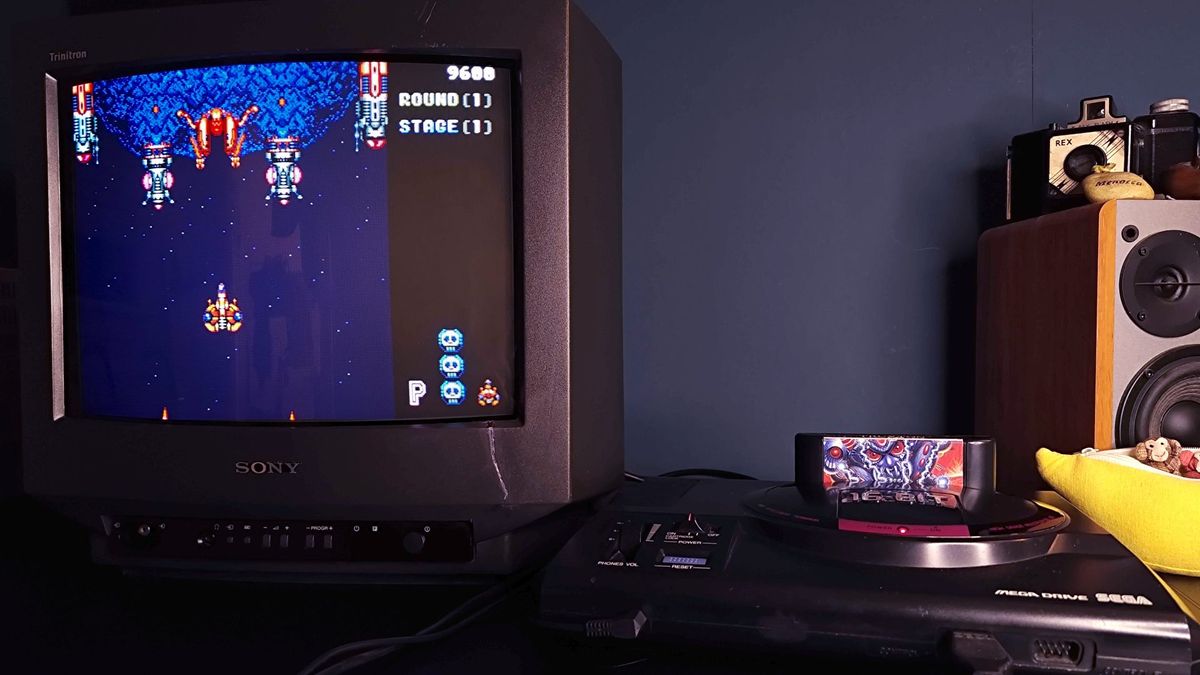 Sega Mega Drive connected to Sony Trinitron CRT with Truxton gameplay on screen.