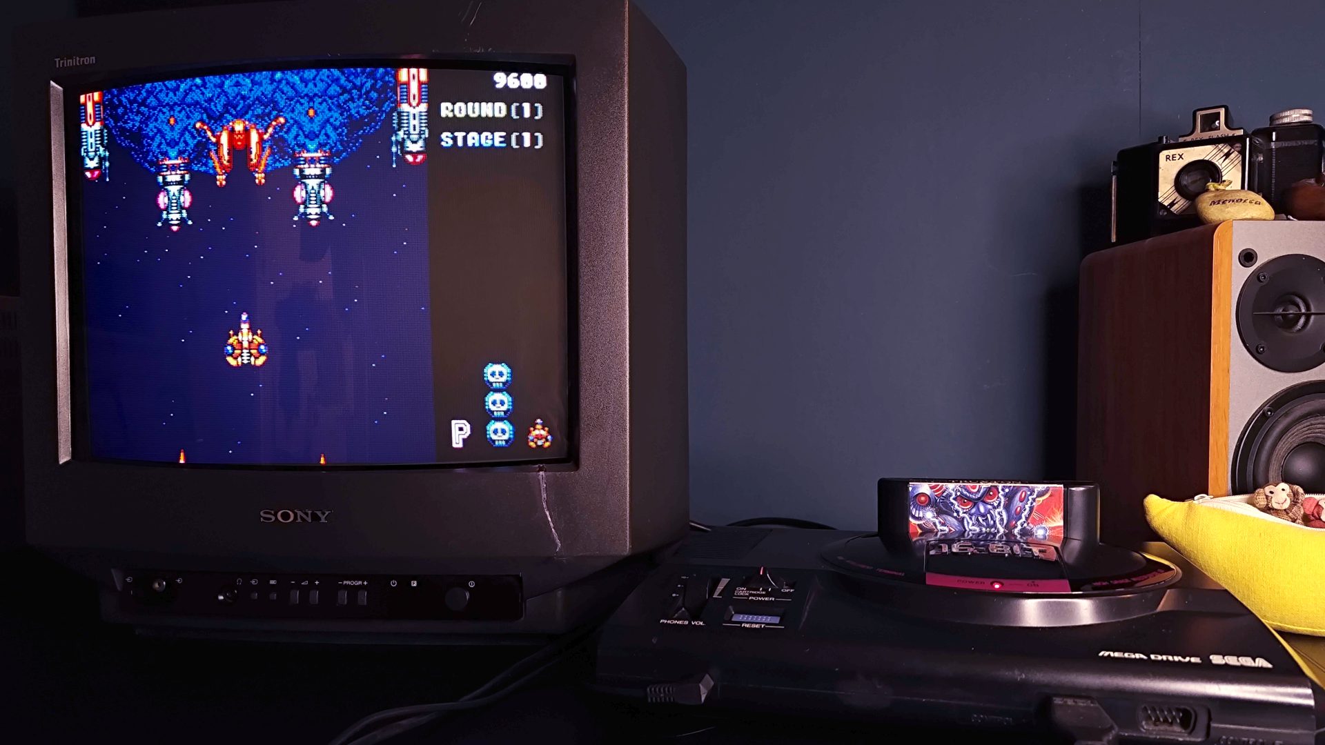 Sega Mega Drive connected to Sony Trinitron CRT with Truxton gameplay on screen.