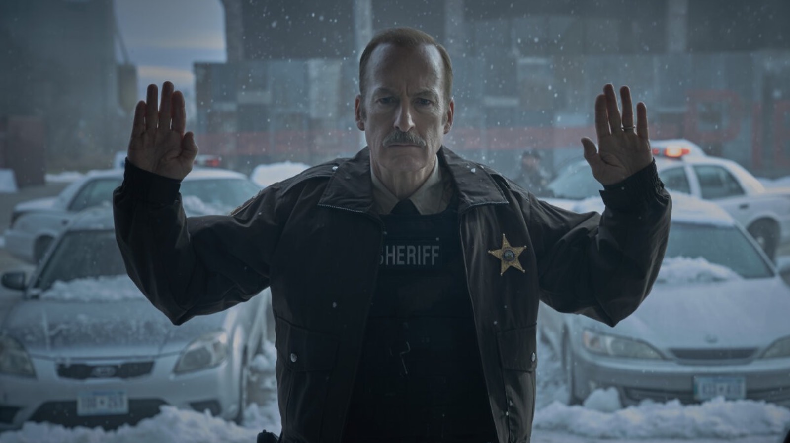 Bob Odenkirk holding his hands up in Normal