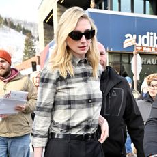 Elizabeth Debicki attends the 2026 Sundance Film Festival wearing Dr. Martens chelsea boots and a plaid shirt
