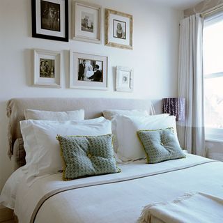 bedroom with white wall and picture frame