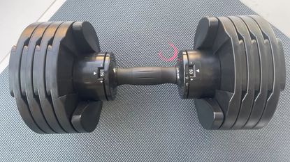 Core Home Fitness Adjustable Dumbbells on a mat