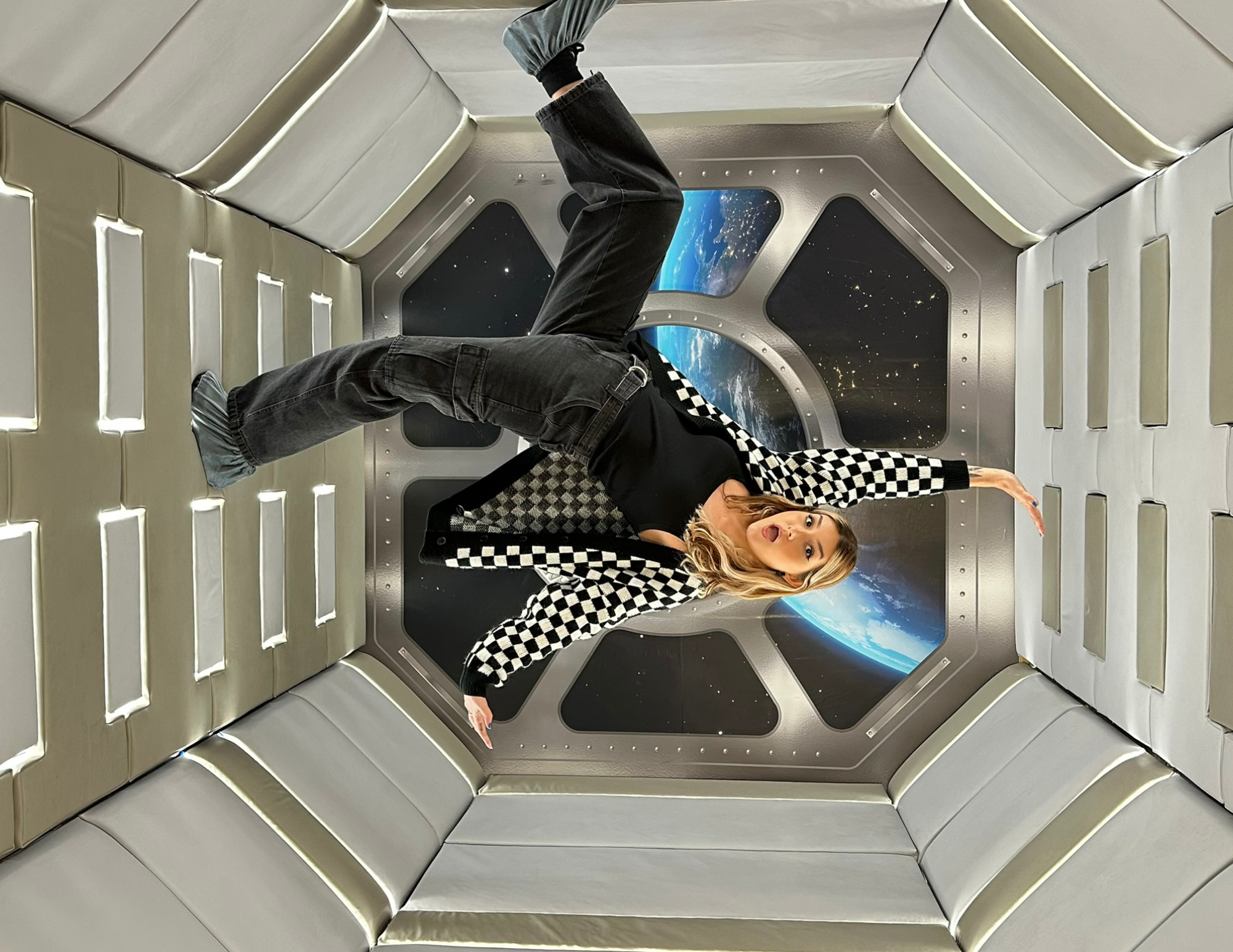 A woman in the Zero Gravity Room at the Paradox Museum in Miami
