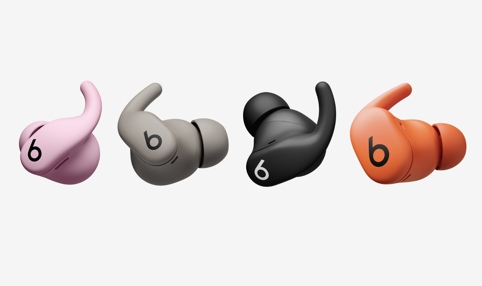 Beats Powerbeats Fit wireless earbuds in a range of colours on a white background