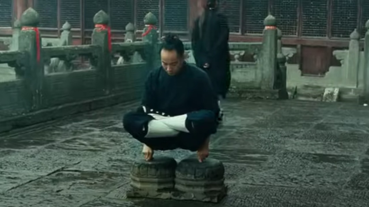 A man doing finger exercises in The Karate Kid