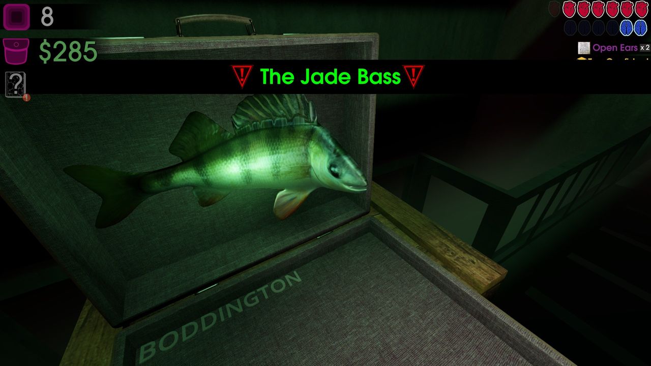 A big mouth billy bass emerging from a suitcase with boss text reading "The Jade Bass"