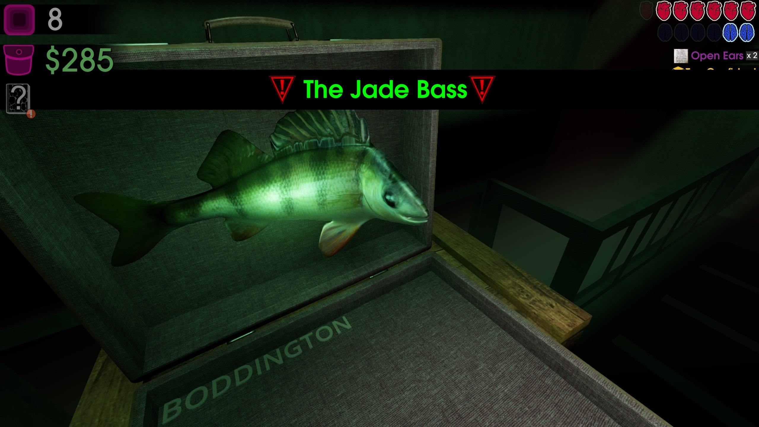 A big mouth billy bass emerging from a suitcase with boss text reading 