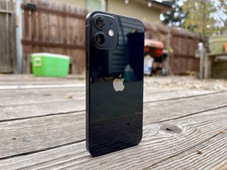 Black iPhone 12 mini standing upright