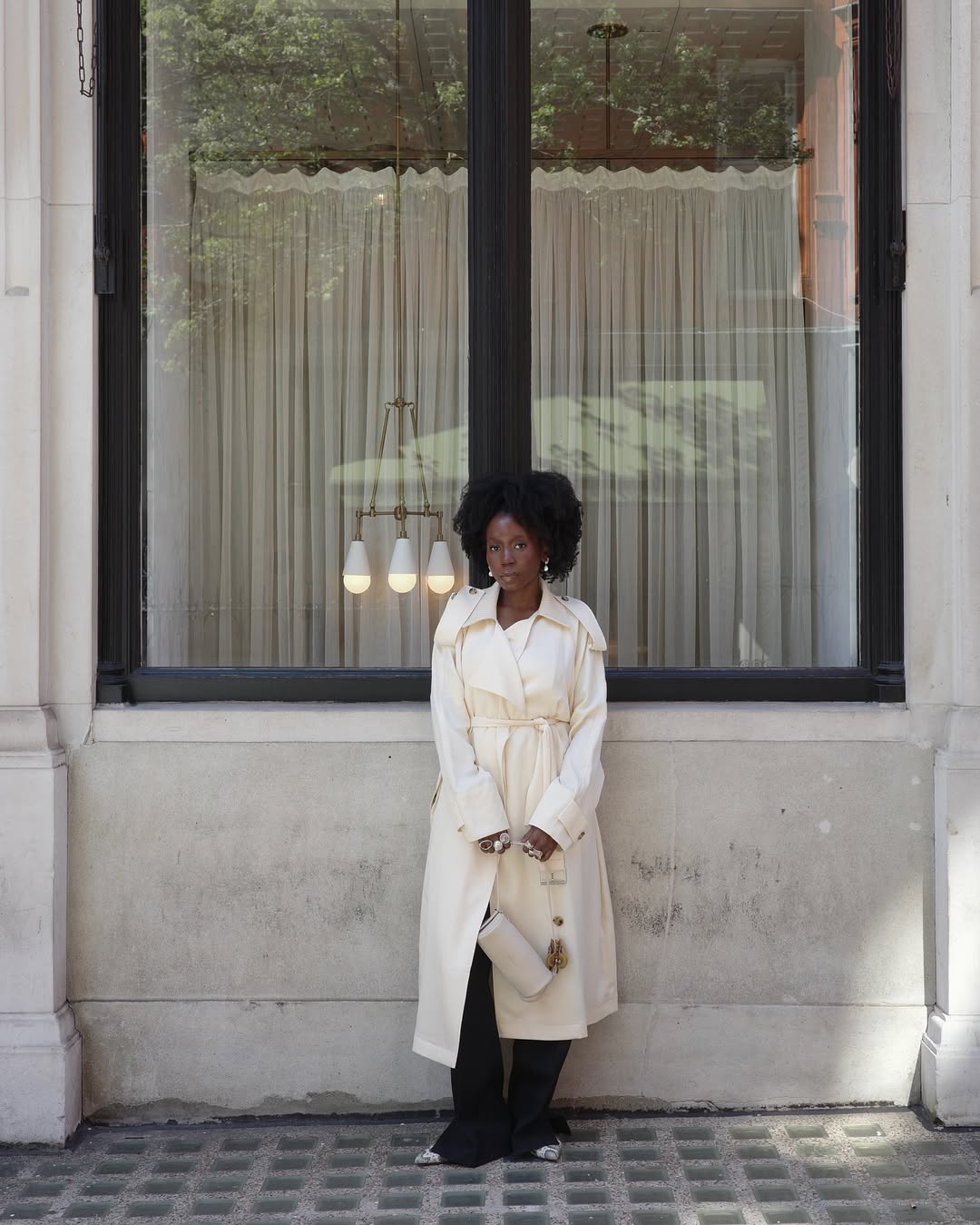 influencer outfit photo featuring a white handbag