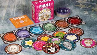 The Skull game box with its array of cards laid out on the table