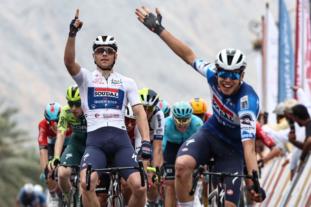 Luke Lamperti celebrates behind teammate and stage winner Paul Magnier during the 2024 Tour of Oman