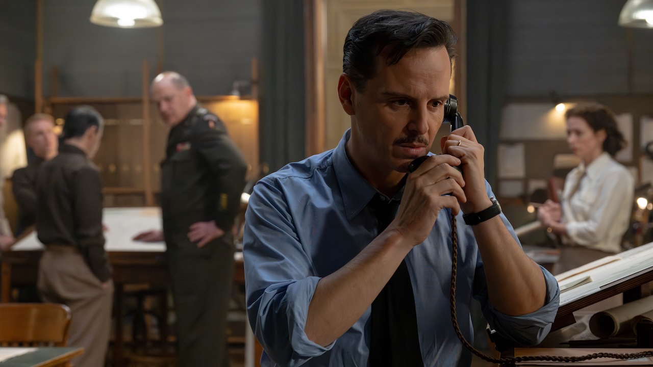Andrew Scott on the phone while Brendan Fraser looks on in the background in Pressure
