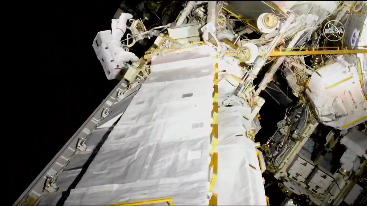 NASA astronaut Anne McClain moves to the S0 truss to store a bag before getting to work with the batteries.