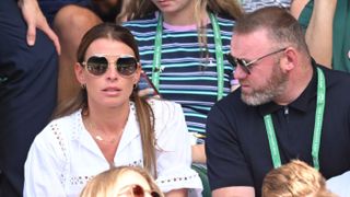 Coleen Rooney and Wayne Rooney attend day 12 of the Wimbledon Tennis Championships
