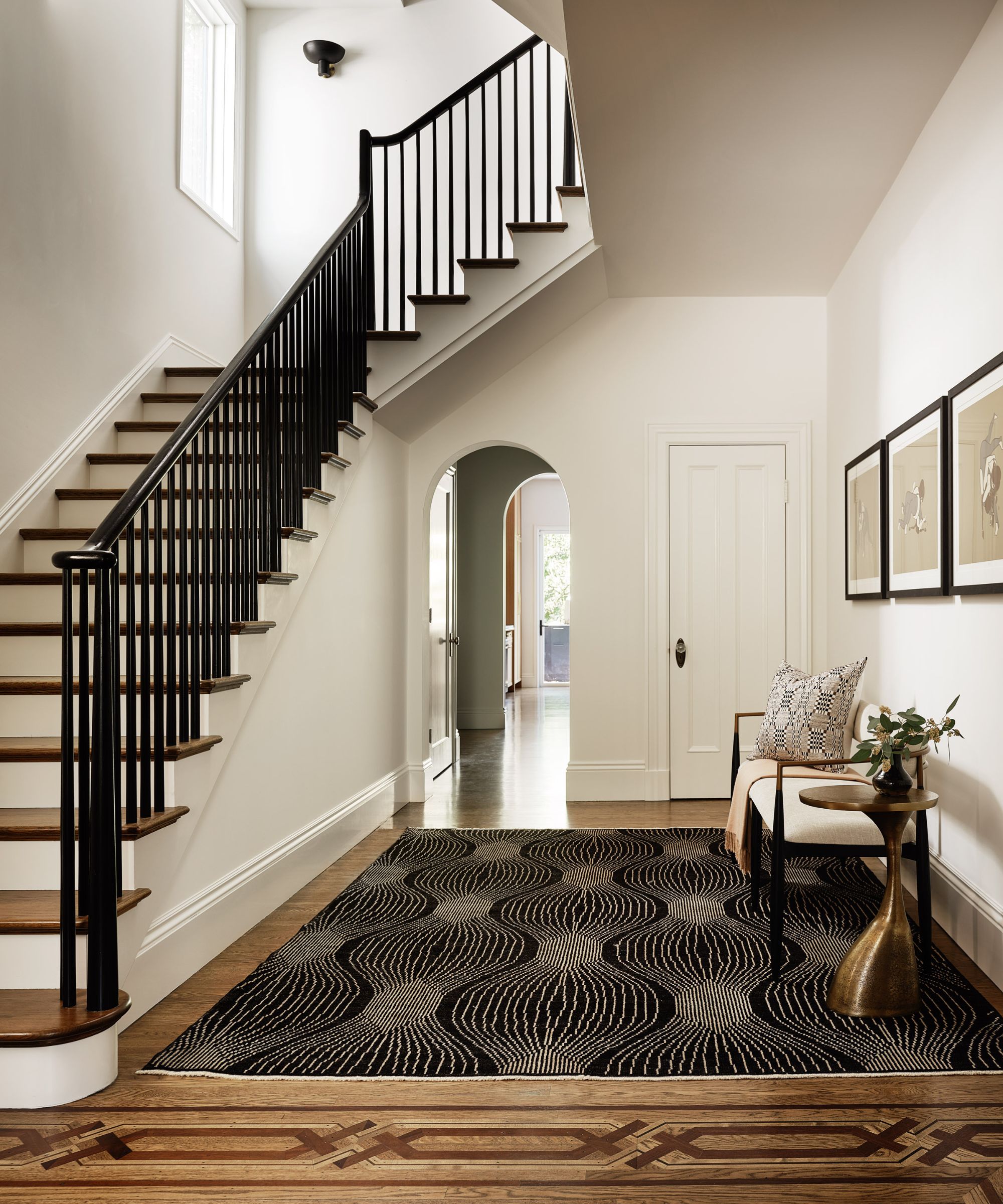 entrance and staircase with bold rug