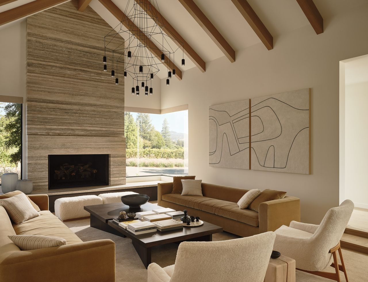 a modern living room with a stone fireplace