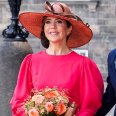 Queen mary of denmark outfit repeats in a hot pink dress from her coronation