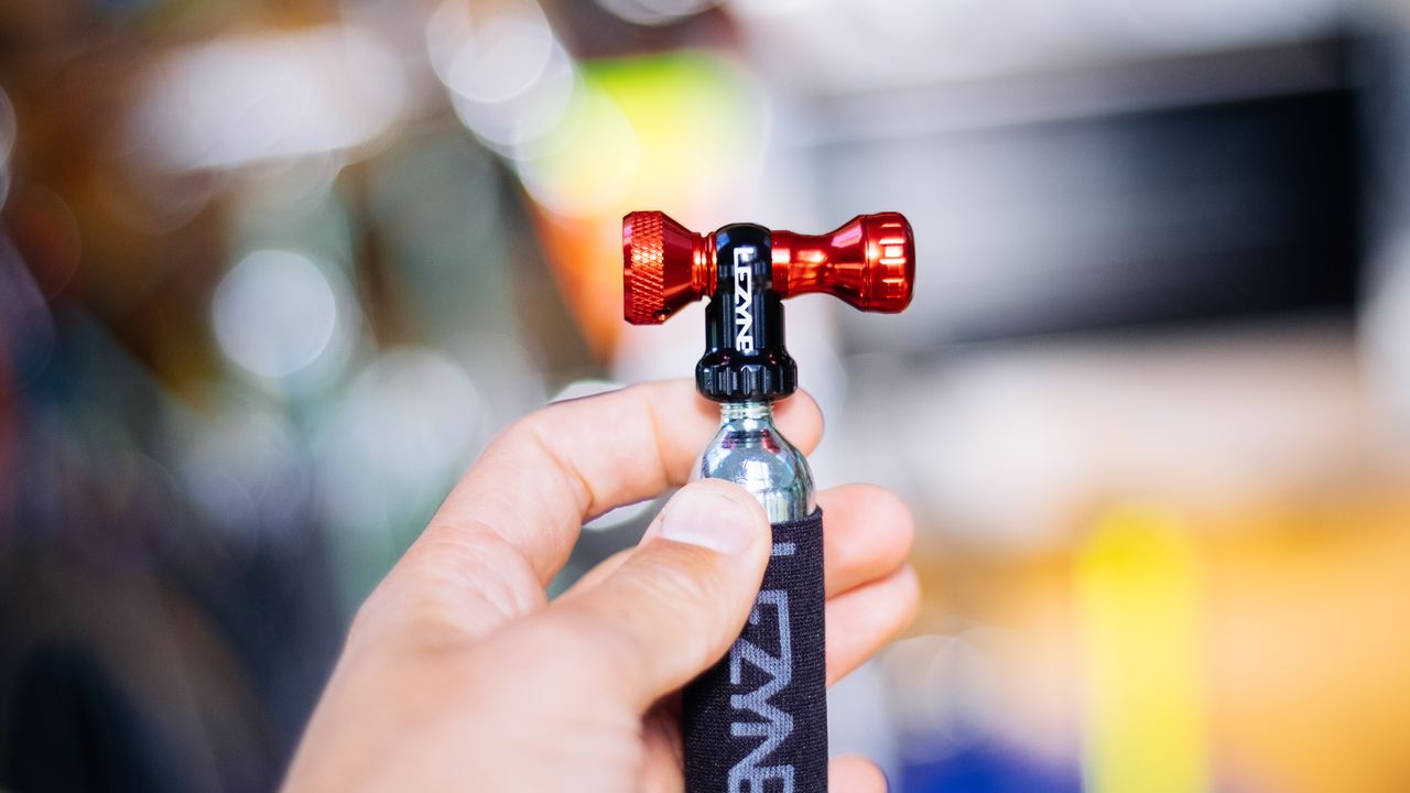 A red lifeline co2 inflator in a hand