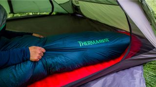Woman using Therm-a-Rest Hyperion 20F/-6C Sleeping Bag