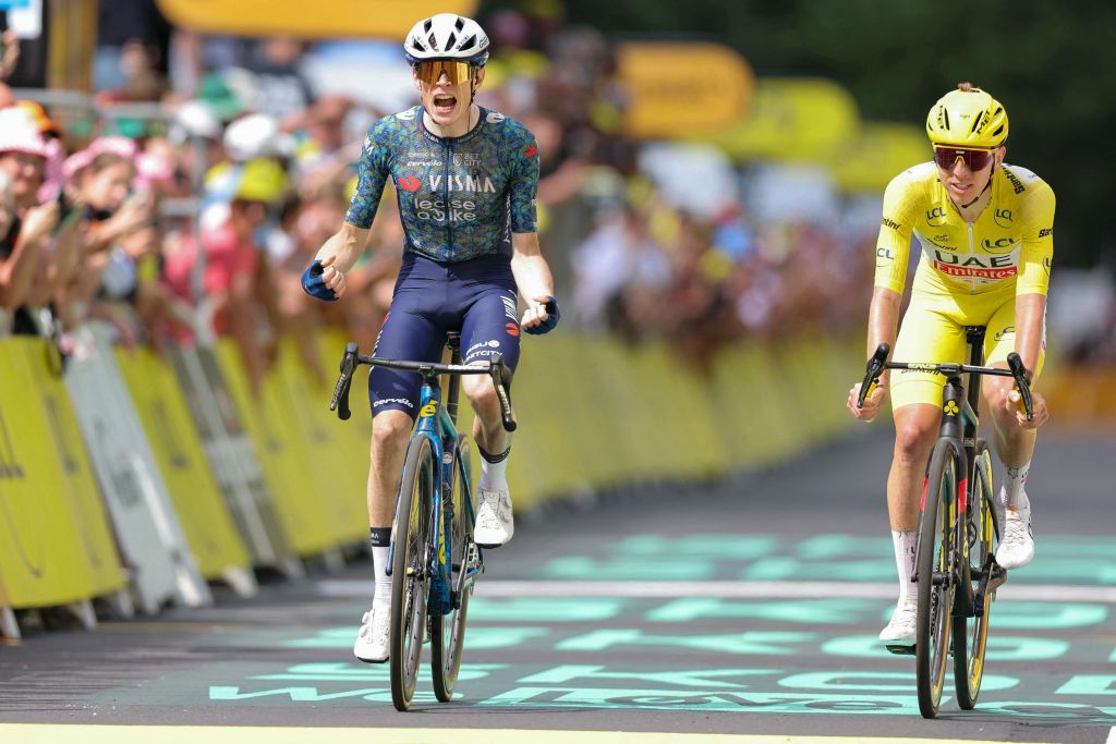 Team Visma - Lease a Bike team's Danish rider Jonas Vingegaard cycles to the finish line to win ahead of UAE Team Emirates team's Slovenian rider Tadej Pogacar wearing the overall leader's yellow jersey (R) during the 11th stage of the 111th edition of the Tour de France cycling race, 211 km between &Atilde;vaux-les-Bains and Le Lioran, on July 10, 2024. (Photo by Thomas SAMSON / AFP)