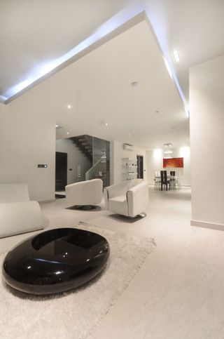 Scissor House by sisa in nigeria with black and white coloured interiors and exteriors