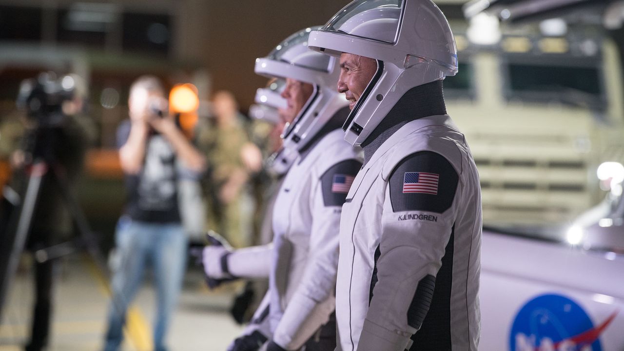From right to left, NASA astronauts Kjell Lindgren, Robert Hines, Jessica Watkins, and ESA (European Space Agency) astronaut Samantha Cristoforetti, wearing SpaceX spacesuits, are seen as they prepare to depart the Neil A. Armstrong Operations and Checkout Building for Launch Complex 39A to board the SpaceX Crew Dragon spacecraft for the Crew-4 mission launch, Tuesday, April 26, 2022, at NASA&rsquo;s Kennedy Space Center in Florida.